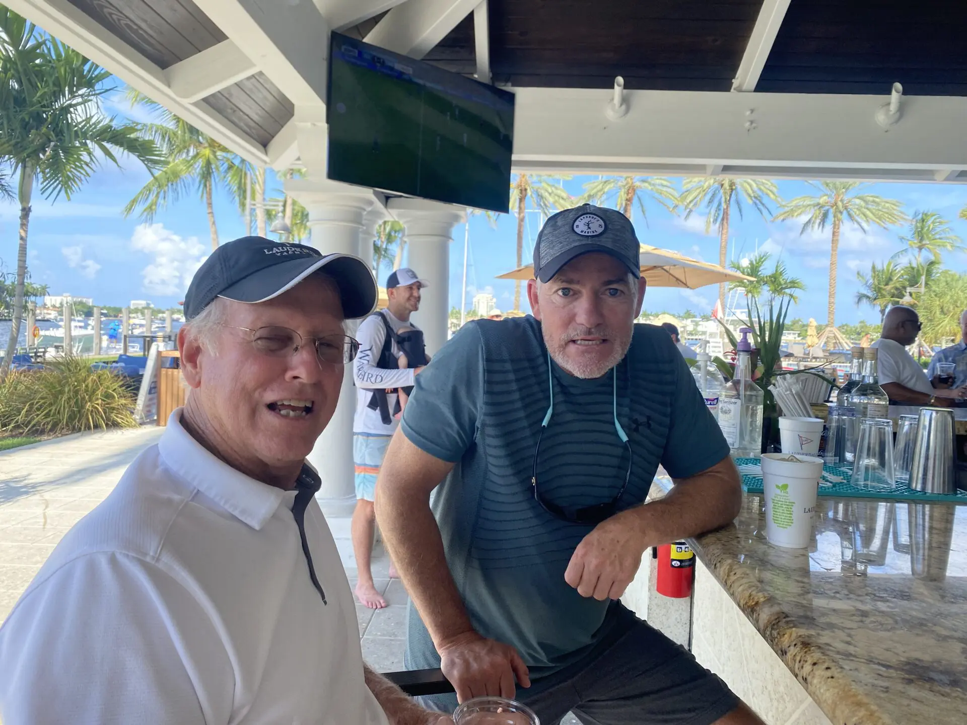 two men on a beach resort bar